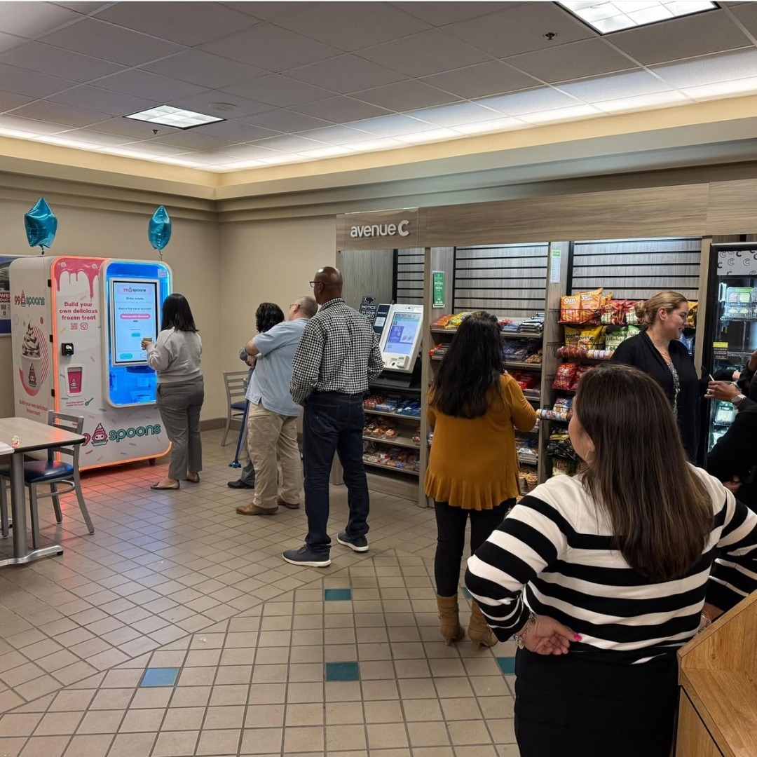 Queue of customers at a 99 Spoons kiosk