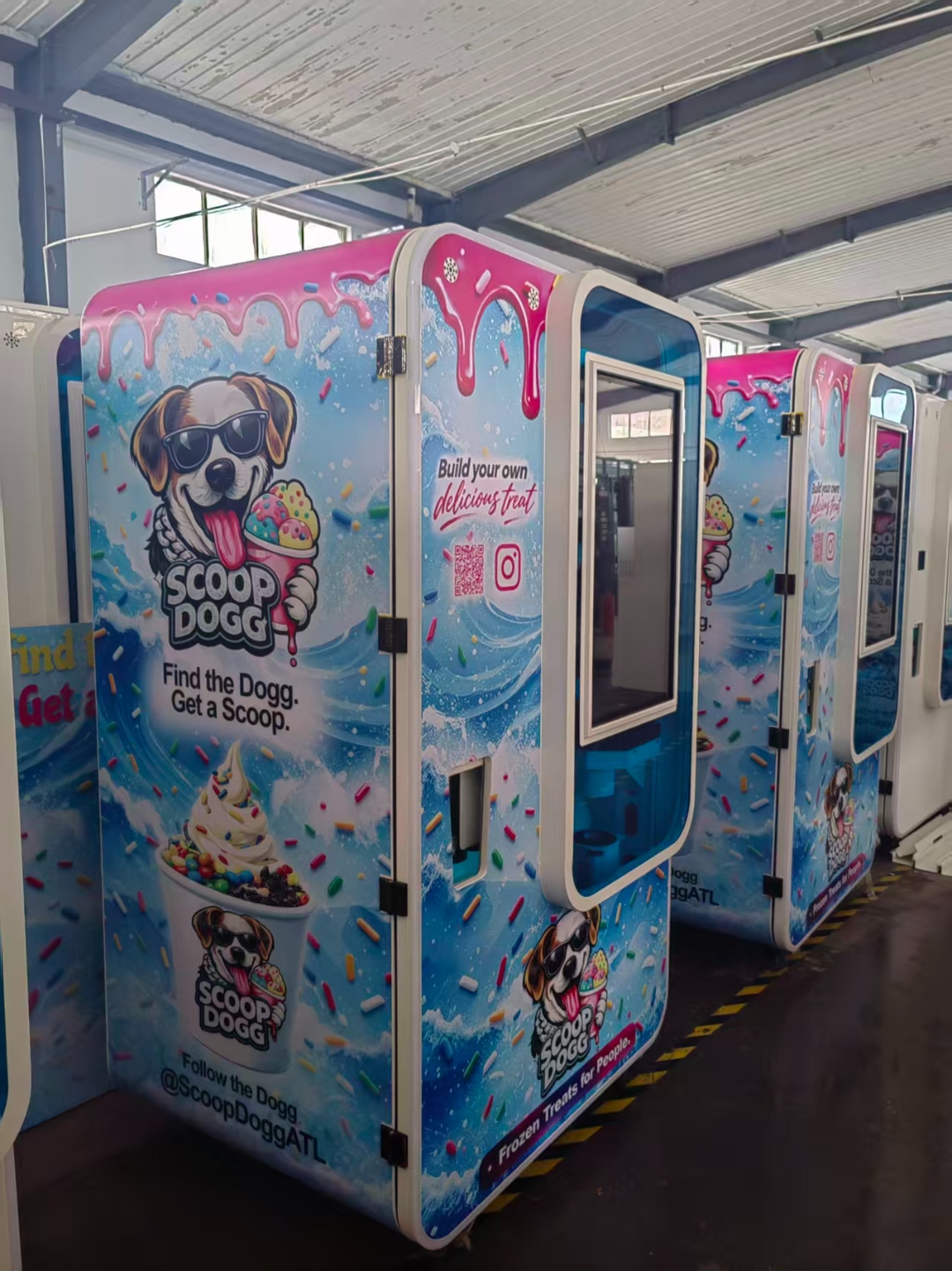 Scoop Dogg machines at factory — full wrap front view